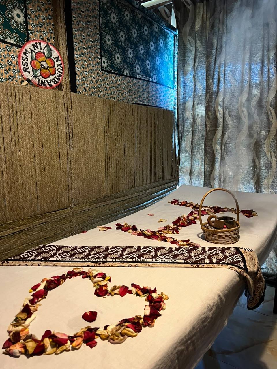 Bridal massage bed with rose-petal heart at Royal Swahili Singo N Massage